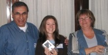 Nathalie Audet, in the middle, receives her award from Alex Roussakis and Linda Iezzi.