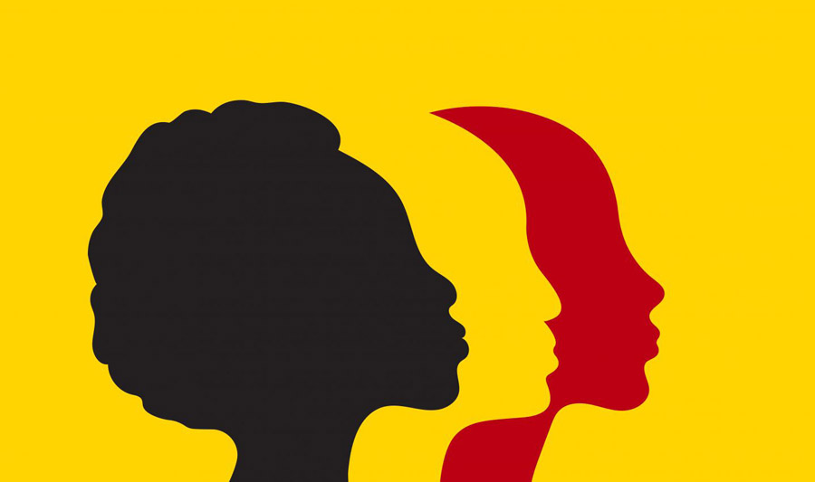 Three silhouettes of women's profiles against a yellow background