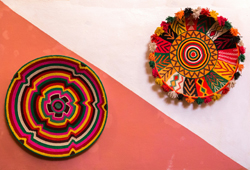 Two colourful woven baskets in traditional African colours